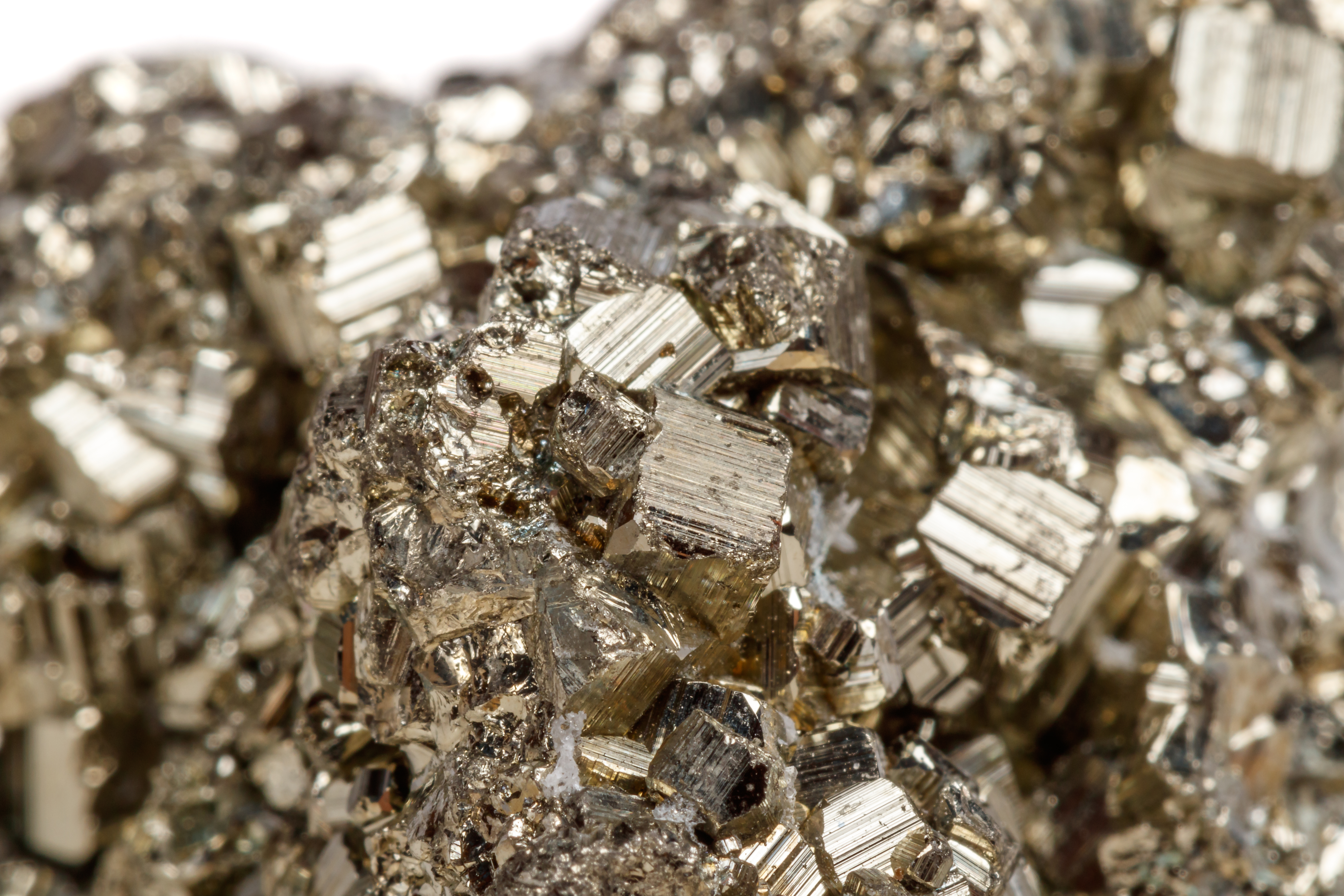 Macro mineral stone Pyrite gold on white background close up